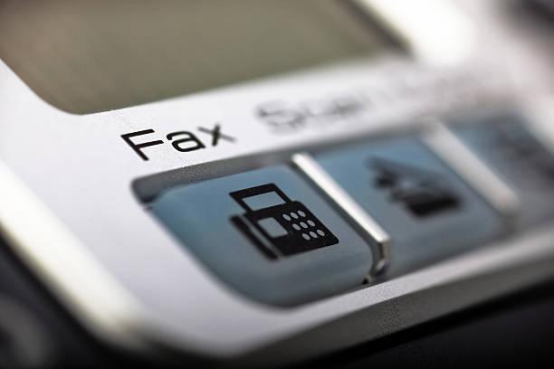 A fax machine button on a multifunctional printer