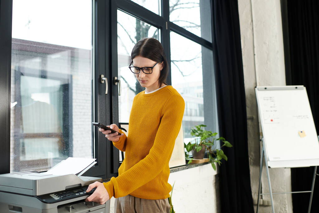 An employee checking the connection of the office printer.